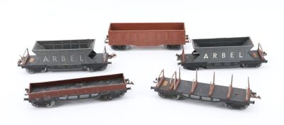 four toy trains that are sitting on a white surface