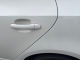 a close up of a door handle on a white car