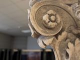 a close up view of a carved column in a building