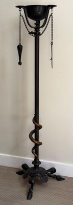a lamp that is sitting on a stand in a room