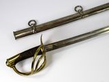 two swords that are on display on a white surface