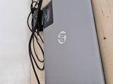 a laptop that is connected to a keyboard on the wall
