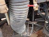 a close up of a truck with a brush on the ground