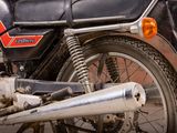 a motorcycle that is parked on the side of the street
