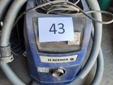 a blue vacuum with a hose and a number 43 on it