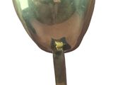 a gold bell on a black stand on a white background