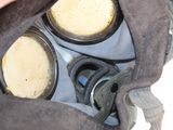 a person holding a gas mask in their hand