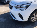 a picture of a white car parked on the side of the road