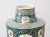 a blue vase with a picture of a man and a woman on it