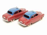 pair of red and blue toy cars on a white surface