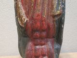 a statue of a man holding a baby in his arms