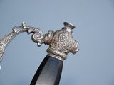 a close up of a knife with a handle on it