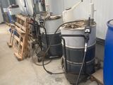 several barrels of water sitting next to each other in a warehouse