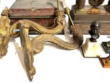 a lot of antique items on a white table