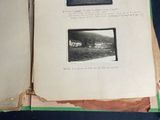 a book open to show pictures of people in a field