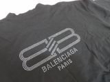 a close up of a black t shirt with a white logo on it