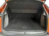 an open trunk of a car with the back seats folded