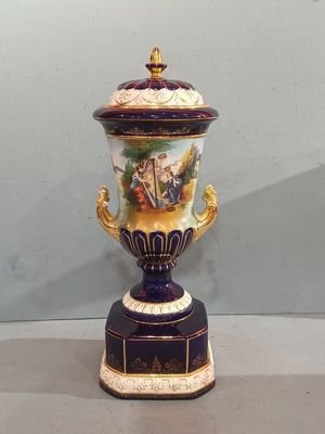a vase that has a painting on it on display