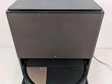 an image of a black speaker with a black cover on top of it
