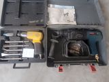 a box with tools in it sitting on the floor