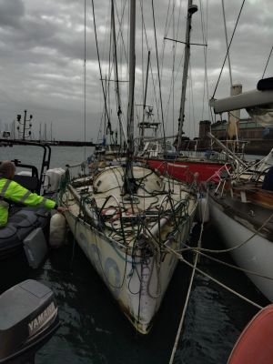 a man that is standing on a boat in the water