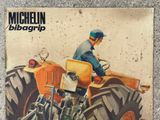 a picture of a man riding a tractor on the cover of a magazine