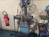 a machine that is sitting in a room next to a fire extinguisor