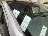 a car that has a lot of stickers on the windshield