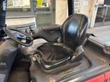 an image of a tractor with a seat and steering