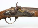 an old gun with a wooden handle on a white background