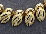 an image of a close up of a necklace on a table