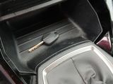 a close up of a car dashboard with a key in it