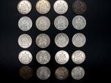 an image of a group of coins sitting on top of a black surface