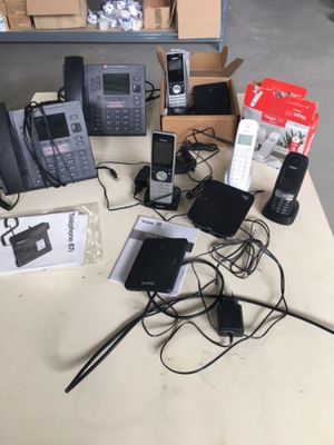 a lot of phones that are sitting on a table