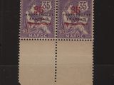 quelques timbres sur un fond noir, représentant un homme et une femme