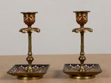 pair of antique brass candlesticks with blue and red glass inserts
