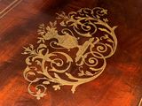 a wooden table with a decorative design on it