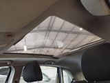 a view of the sunroof from inside of a car