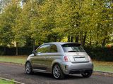 a car that is driving down the road in the park