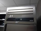 an image of a refrigerator in a kitchen with the number 24 on it
