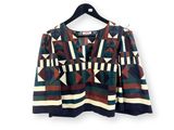 a women ' s jacket with geometric pattern on the shoulders