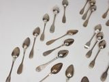 a lot of spoons and spoon spoons on the table