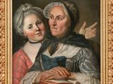 un tableau représentant deux femmes tenant un livre à la main