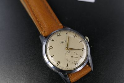an image of a wrist watch with a brown leather strap