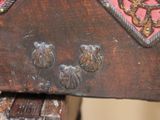 a close up of a piece of wood with a design on it
