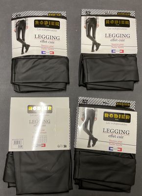 four pairs of legging tights are on display on a table