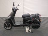 a scooter that is parked on a checkered floor