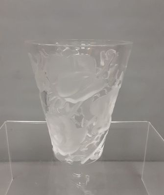 clear glass vase on a clear shelf with a white background