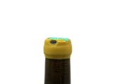 a bottle of wine with a yellow cap on it