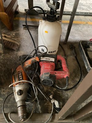 a picture of a drill and other tools on the floor